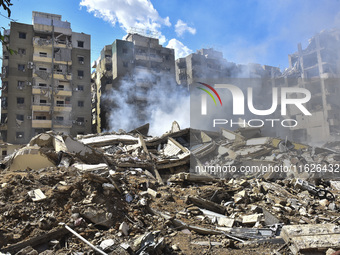 The destruction at the site of an overnight Israeli airstrike on the Laylaki, Harat Hreik, and Sant Tares neighborhoods in Beirut's southern...