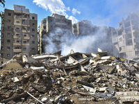 The destruction at the site of an overnight Israeli airstrike on the Laylaki, Harat Hreik, and Sant Tares neighborhoods in Beirut's southern...