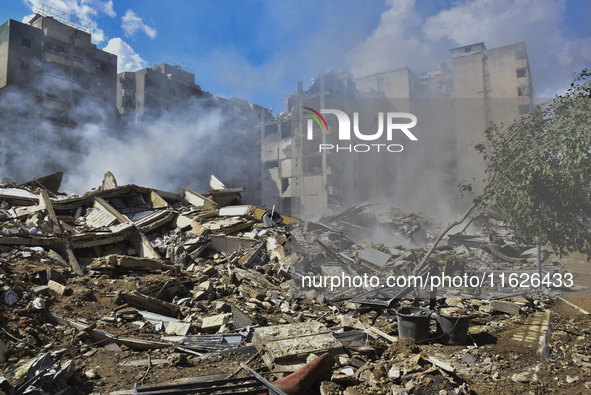 The destruction at the site of an overnight Israeli airstrike on the Laylaki, Harat Hreik, and Sant Tares neighborhoods in Beirut's southern...