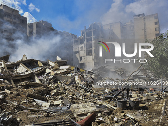 The destruction at the site of an overnight Israeli airstrike on the Laylaki, Harat Hreik, and Sant Tares neighborhoods in Beirut's southern...