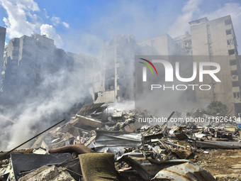 The destruction at the site of an overnight Israeli airstrike on the Laylaki, Harat Hreik, and Sant Tares neighborhoods in Beirut's southern...