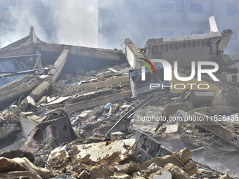 The destruction at the site of an overnight Israeli airstrike on the Laylaki, Harat Hreik, and Sant Tares neighborhoods in Beirut's southern...