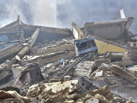 The destruction at the site of an overnight Israeli airstrike on the Laylaki, Harat Hreik, and Sant Tares neighborhoods in Beirut's southern...