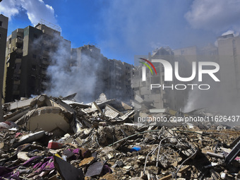 The destruction at the site of an overnight Israeli airstrike on the Laylaki, Harat Hreik, and Sant Tares neighborhoods in Beirut's southern...