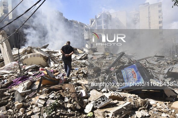 The destruction at the site of an overnight Israeli airstrike on the Laylaki, Harat Hreik, and Sant Tares neighborhoods in Beirut's southern...