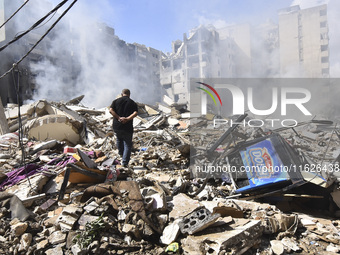 The destruction at the site of an overnight Israeli airstrike on the Laylaki, Harat Hreik, and Sant Tares neighborhoods in Beirut's southern...