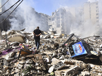 The destruction at the site of an overnight Israeli airstrike on the Laylaki, Harat Hreik, and Sant Tares neighborhoods in Beirut's southern...