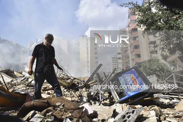 The destruction at the site of an overnight Israeli airstrike on the Laylaki, Harat Hreik, and Sant Tares neighborhoods in Beirut's southern...