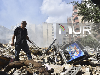 The destruction at the site of an overnight Israeli airstrike on the Laylaki, Harat Hreik, and Sant Tares neighborhoods in Beirut's southern...