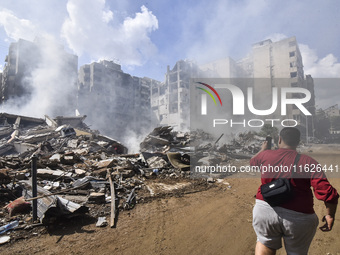 The destruction at the site of an overnight Israeli airstrike on the Laylaki, Harat Hreik, and Sant Tares neighborhoods in Beirut's southern...