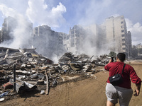 The destruction at the site of an overnight Israeli airstrike on the Laylaki, Harat Hreik, and Sant Tares neighborhoods in Beirut's southern...