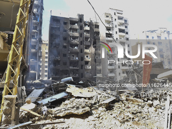 The destruction at the site of an overnight Israeli airstrike on the Laylaki, Harat Hreik, and Sant Tares neighborhoods in Beirut's southern...