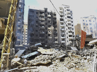 The destruction at the site of an overnight Israeli airstrike on the Laylaki, Harat Hreik, and Sant Tares neighborhoods in Beirut's southern...