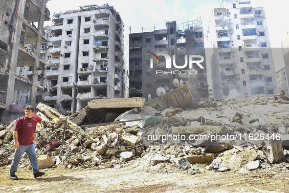 The destruction at the site of an overnight Israeli airstrike on the Laylaki, Harat Hreik, and Sant Tares neighborhoods in Beirut's southern...