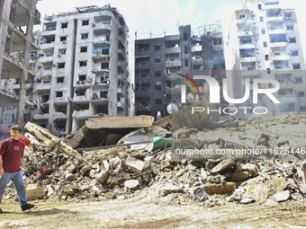 The destruction at the site of an overnight Israeli airstrike on the Laylaki, Harat Hreik, and Sant Tares neighborhoods in Beirut's southern...