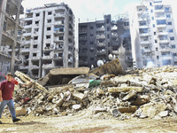 The destruction at the site of an overnight Israeli airstrike on the Laylaki, Harat Hreik, and Sant Tares neighborhoods in Beirut's southern...