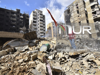 The destruction at the site of an overnight Israeli airstrike on the Laylaki, Harat Hreik, and Sant Tares neighborhoods in Beirut's southern...