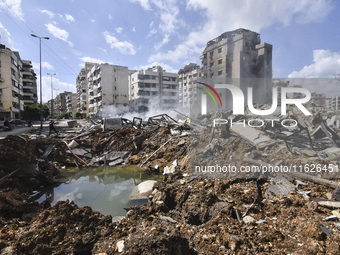 The destruction at the site of an overnight Israeli airstrike on the Laylaki, Harat Hreik, and Sant Tares neighborhoods in Beirut's southern...