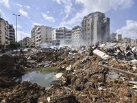 The destruction at the site of an overnight Israeli airstrike on the Laylaki, Harat Hreik, and Sant Tares neighborhoods in Beirut's southern...