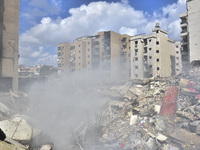 The destruction at the site of an overnight Israeli airstrike on the Laylaki, Harat Hreik, and Sant Tares neighborhoods in Beirut's southern...