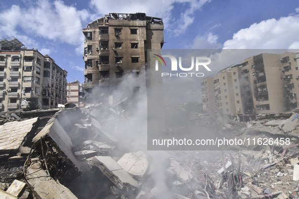 The destruction at the site of an overnight Israeli airstrike on the Laylaki, Harat Hreik, and Sant Tares neighborhoods in Beirut's southern...