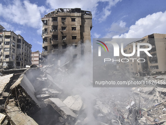 The destruction at the site of an overnight Israeli airstrike on the Laylaki, Harat Hreik, and Sant Tares neighborhoods in Beirut's southern...