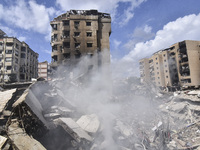 The destruction at the site of an overnight Israeli airstrike on the Laylaki, Harat Hreik, and Sant Tares neighborhoods in Beirut's southern...