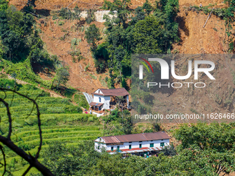 Nakhu River flooding damages homes in the Tikabhairab region of southern Lalitpur, Nepal, on October 1, 2024. Homes are severely damaged, wi...