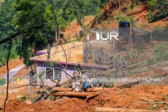 Rescue teams search for missing people in the Tikabhairab landslides caused by heavy rainfall in southern Lalitpur, Nepal, on October 01, 20...