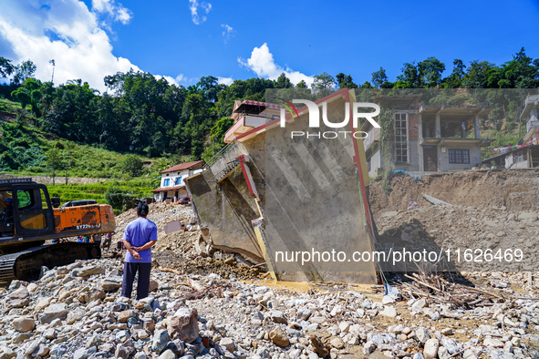 Nakhu River flooding damages homes in the Tikabhairab region of southern Lalitpur, Nepal, on October 01, 2024. Homes are severely damaged, w...