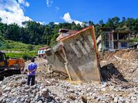 Nakhu River flooding damages homes in the Tikabhairab region of southern Lalitpur, Nepal, on October 01, 2024. Homes are severely damaged, w...