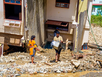 People search for their belongings in damaged houses after Nakhu River flooding in the Tikabhairab region of southern Lalitpur, Nepal, on Oc...