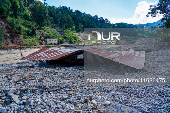 Nakhu River flooding damages homes in the Tikabhairab region of southern Lalitpur, Nepal, on October 1, 2024. Homes are severely damaged, wi...