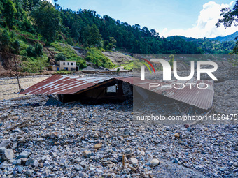 Nakhu River flooding damages homes in the Tikabhairab region of southern Lalitpur, Nepal, on October 1, 2024. Homes are severely damaged, wi...