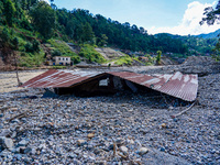 Nakhu River flooding damages homes in the Tikabhairab region of southern Lalitpur, Nepal, on October 1, 2024. Homes are severely damaged, wi...