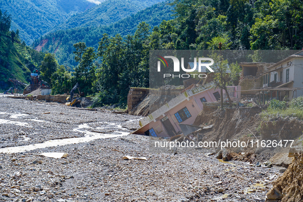 Nakhu River flooding damages homes in the Tikabhairab region of southern Lalitpur, Nepal, on October 1, 2024. Homes are severely damaged, wi...