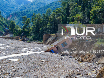 Nakhu River flooding damages homes in the Tikabhairab region of southern Lalitpur, Nepal, on October 1, 2024. Homes are severely damaged, wi...