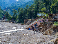 Nakhu River flooding damages homes in the Tikabhairab region of southern Lalitpur, Nepal, on October 1, 2024. Homes are severely damaged, wi...