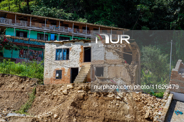 Nakhu River flooding damages homes in the Tikabhairab region of southern Lalitpur, Nepal, on October 1, 2024. Homes are severely damaged, wi...