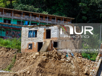 Nakhu River flooding damages homes in the Tikabhairab region of southern Lalitpur, Nepal, on October 1, 2024. Homes are severely damaged, wi...