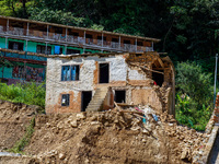 Nakhu River flooding damages homes in the Tikabhairab region of southern Lalitpur, Nepal, on October 1, 2024. Homes are severely damaged, wi...