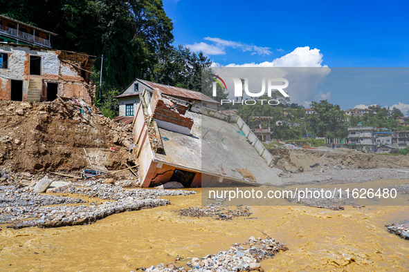 Nakhu River flooding damages homes in the Tikabhairab region of southern Lalitpur, Nepal, on October 1, 2024. Homes are severely damaged, wi...