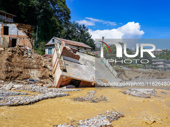 Nakhu River flooding damages homes in the Tikabhairab region of southern Lalitpur, Nepal, on October 1, 2024. Homes are severely damaged, wi...