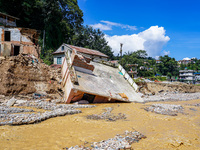 Nakhu River flooding damages homes in the Tikabhairab region of southern Lalitpur, Nepal, on October 1, 2024. Homes are severely damaged, wi...