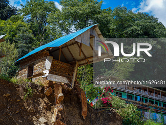 Nakhu River flooding damages homes in the Tikabhairab region of southern Lalitpur, Nepal, on October 1, 2024. Homes are severely damaged, wi...