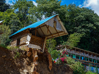 Nakhu River flooding damages homes in the Tikabhairab region of southern Lalitpur, Nepal, on October 1, 2024. Homes are severely damaged, wi...