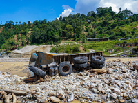 The Nakhu River flooding sweeps and damages a vehicle in the Tikabhairab region of southern Lalitpur, Nepal, on October 1, 2024. (