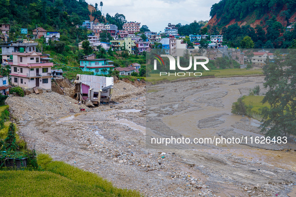 Nakhu River flooding damages homes in the Tikabhairab region of southern Lalitpur, Nepal, on October 1, 2024. Homes are severely damaged, wi...