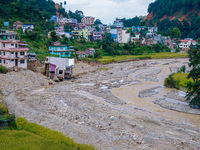 Nakhu River flooding damages homes in the Tikabhairab region of southern Lalitpur, Nepal, on October 1, 2024. Homes are severely damaged, wi...