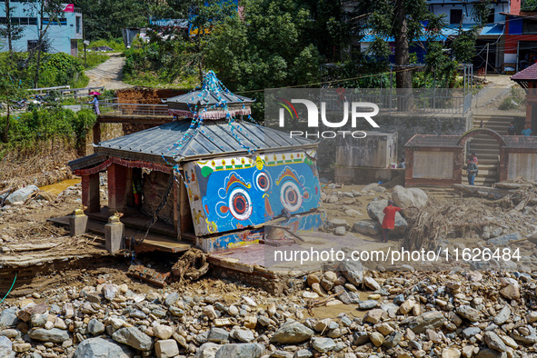 The Nakhu River flooding damages a temple in the Tikabhairab region of southern Lalitpur, Nepal, on October 1, 2024. Homes are severely dama...